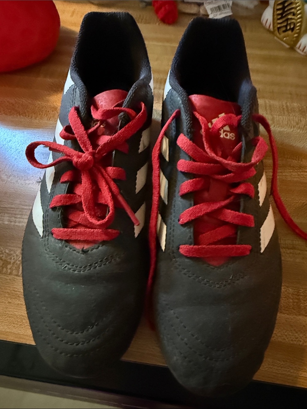 adidas Kids Black cleats with Red Laces and White Stripes